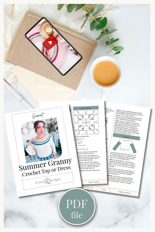 Image of a crochet pattern PDF file titled "Summer Granny: Crochet Top or Dress" by Briana K Designs, displayed alongside crochet materials, a cup of coffee, greenery on a white surface.