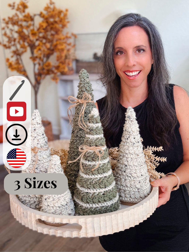 A woman with long dark hair holds a round tray displaying three crochet cone-shaped Christmas trees in different sizes—a perfect handmade gift. Autumn decor fills the background. Icons and text overlay read "3 Sizes.