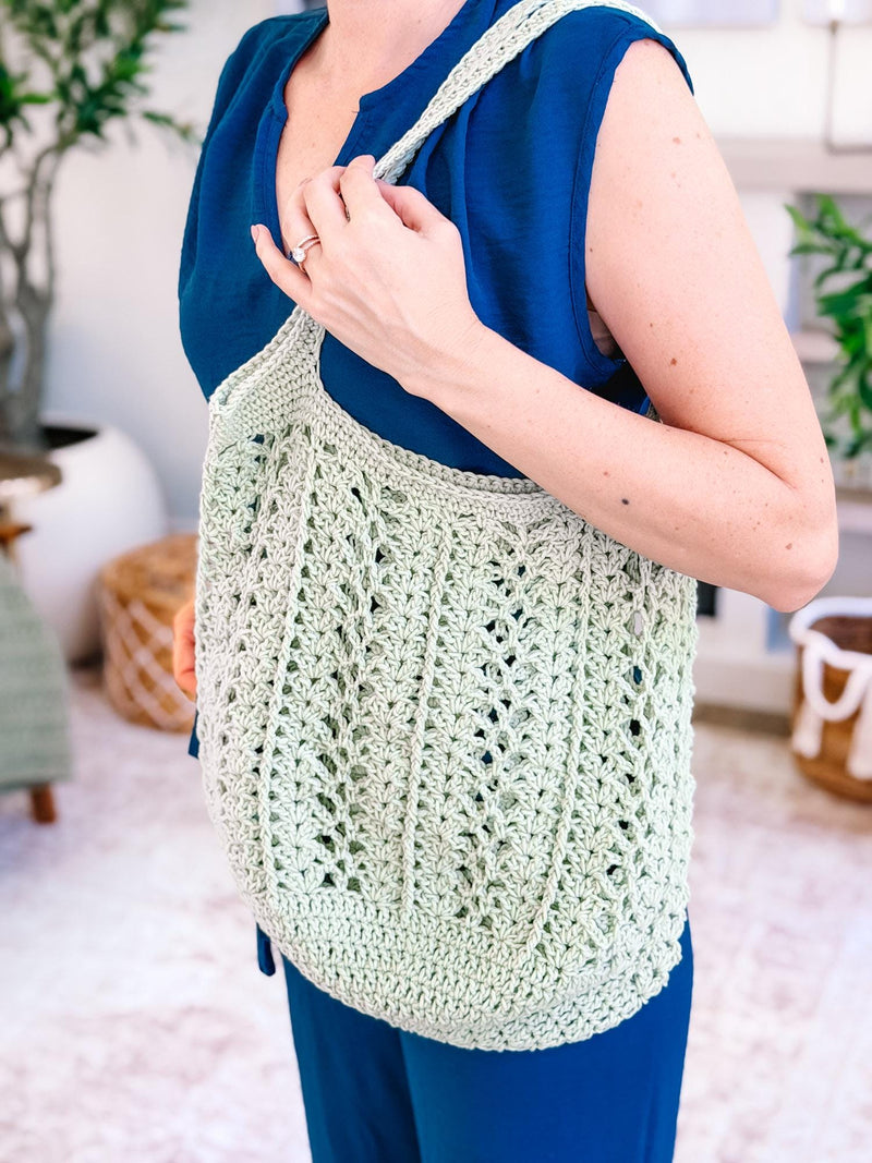 Sage green Willow Mesh crochet market bag showing the openwork stitch