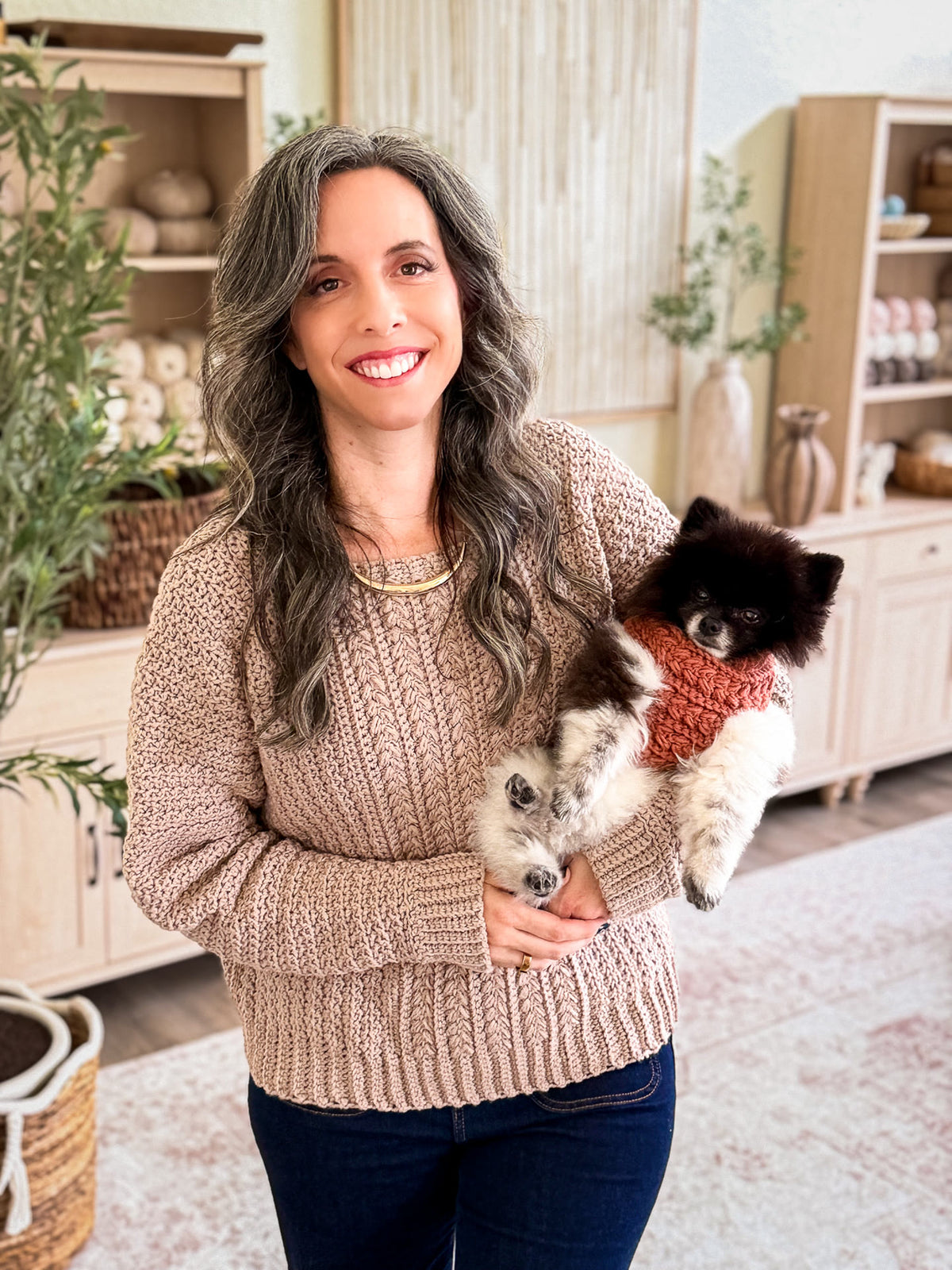 Briana and her dog in matching Wheat Stitch crochet sweaters