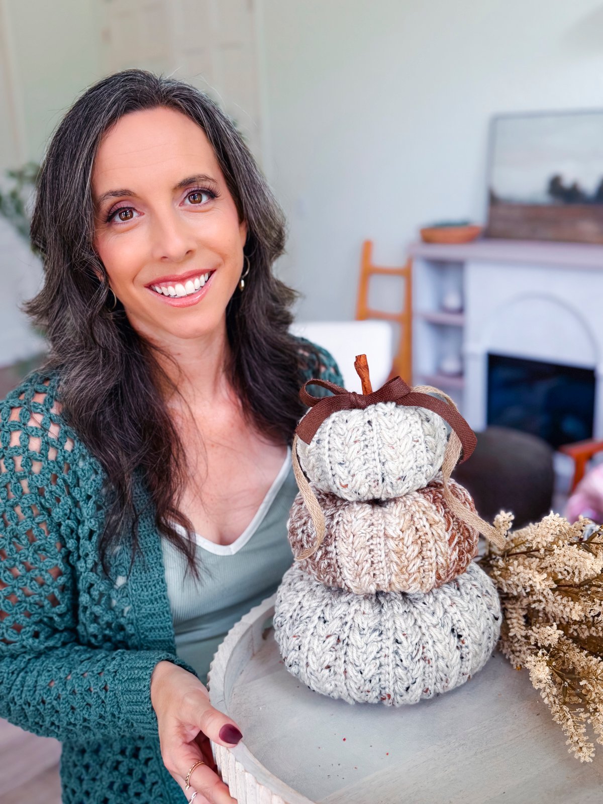 Fall crochet pattern bundle, Briana holding the stacked pumpkin trio
