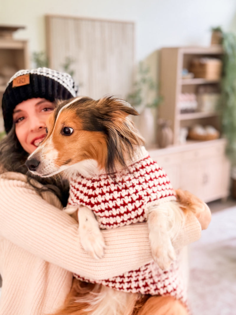 Briana and her dog in matching houndstooth crochet beanie and dog sweater