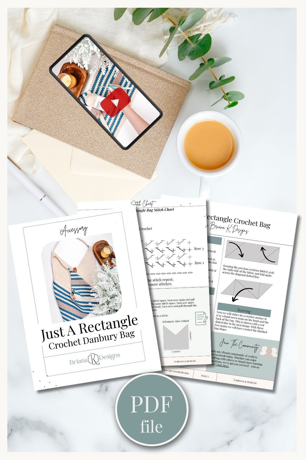 An open crochet pattern booklet for a rectangular bag is displayed alongside a cup of tea, a phone showing the bag, and some leaves for decoration. A "PDF file" label is prominently featured, making it easy to create this handmade gift.