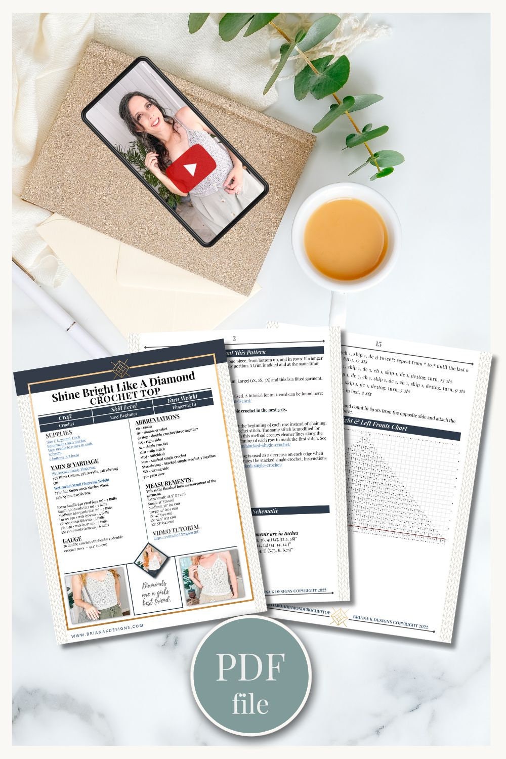 A knitting guide titled "Shine Bright Like A Diamond Crochet Top" displayed next to a cup of tea, an envelope with a tablet showing a video thumbnail, and plant leaves on a desk. A "PDF file" label is shown.