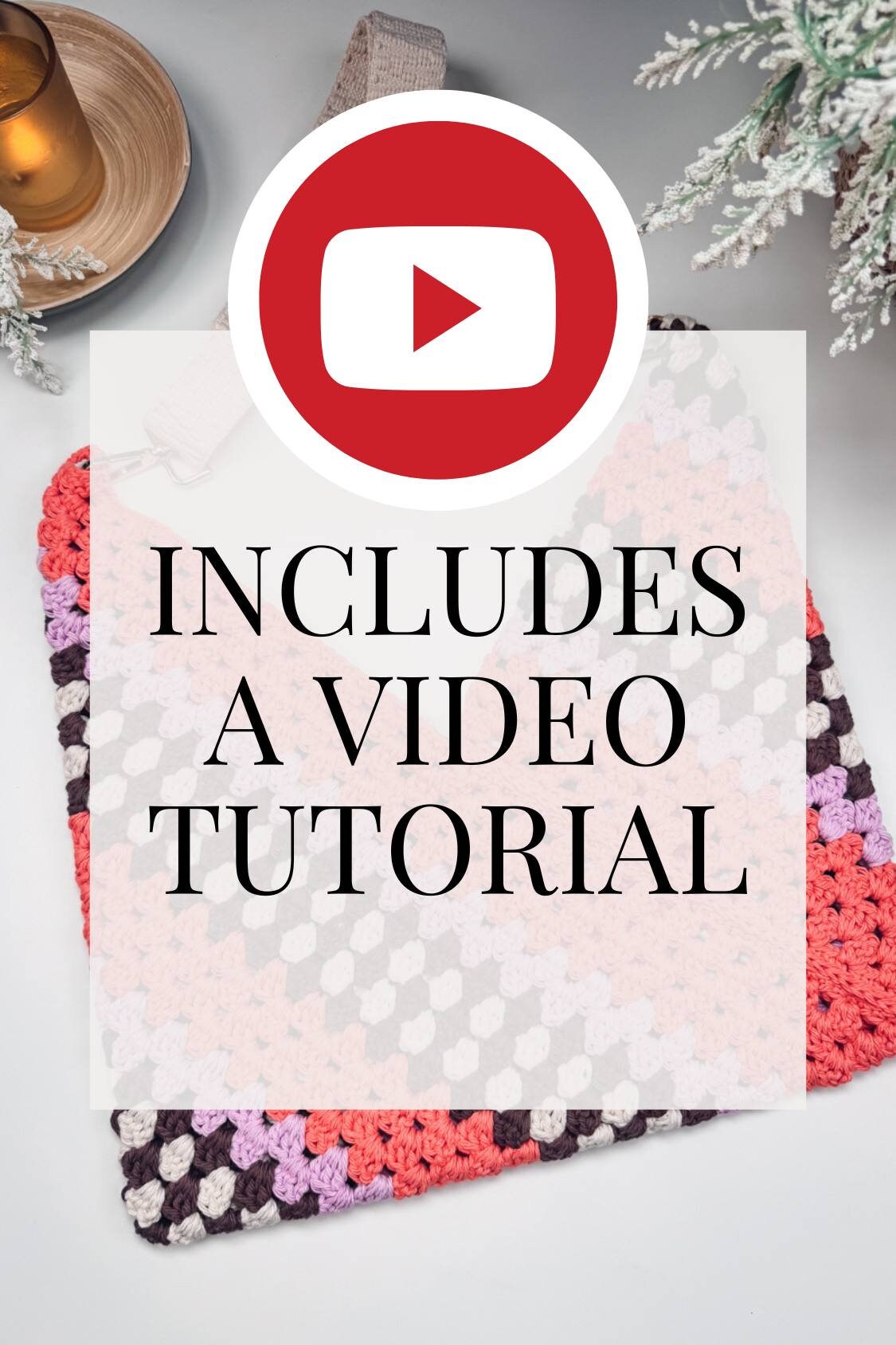 Square crochet piece with multi-colored yarn next to a small plant and a candle holder. A YouTube logo and the text "INCLUDES A VIDEO TUTORIAL" are overlaid on the image, making it perfect for crafting a handmade gift.
