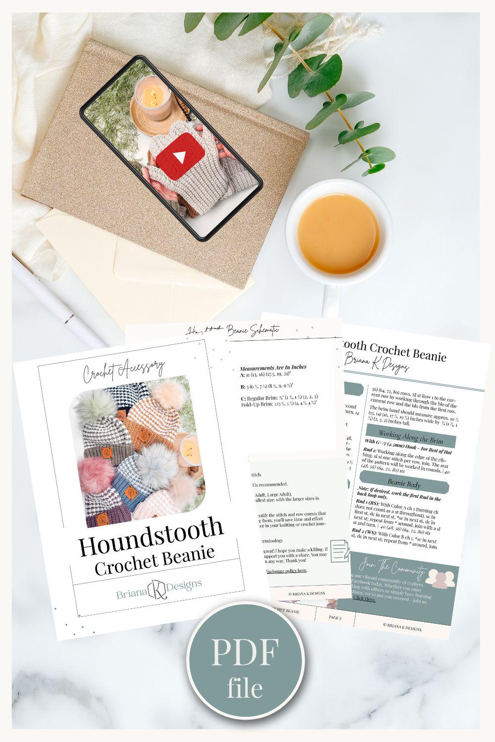 Crochet beanie pattern PDF displayed with a phone showing a video thumbnail, notebook, pen, plant, and cup of coffee on a light background—a perfect handmade gift for those who cherish personal touches.
