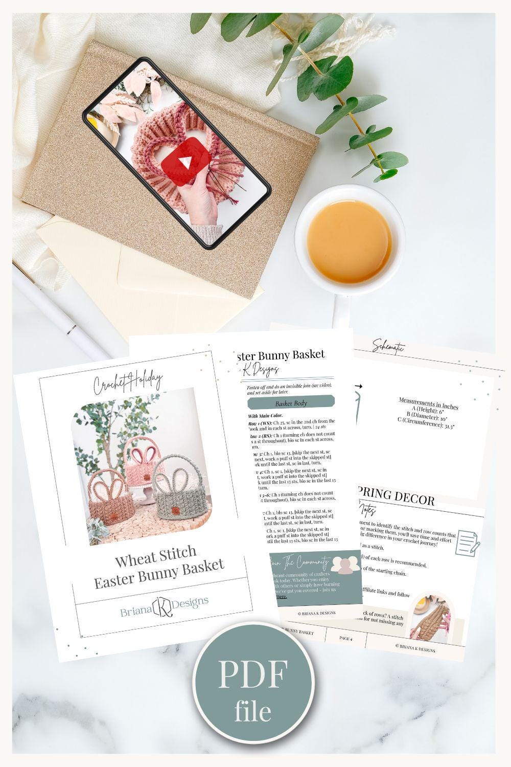 Flat lay of a phone with a play button, coffee cup, envelope, eucalyptus, and crochet crafting instruction sheets labeled "Wheat Stitch Easter Bunny Basket," Easter YouTube Play Button