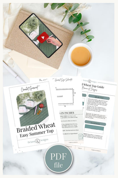 Pattern PDF pages for a crochet top and a phone showing the video tutorial, laid out with tea and greenery