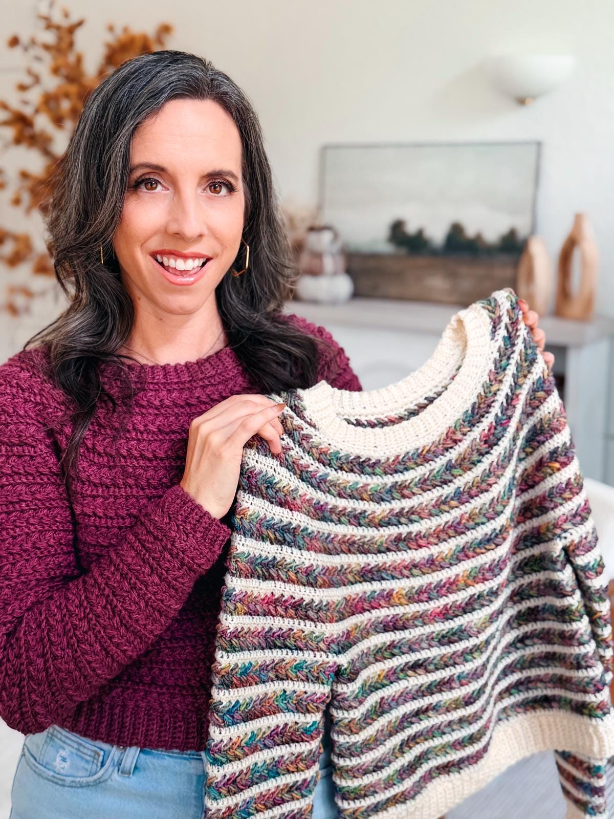 Woman modeling the Wheat Stitch Crochet Sweater; multicolor textured pullover pattern includes 9 inclusive sizes, no-sew construction, and full video tutorial for easy crocheting.