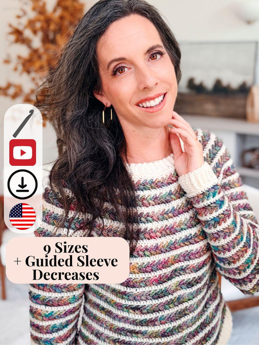 Woman wearing a colorful handmade crochet sweater smiles warmly at the camera; text overlay highlights 9 sizes and guided sleeve decreases included in the Wheat Stitch Sweater pattern — a cozy handmade gift idea.