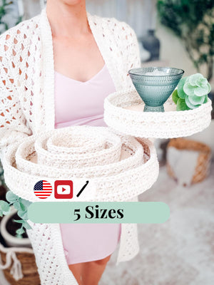 Woman holding stacked cream crochet trays and a smaller tray with a blue glass, with a 5 sizes label