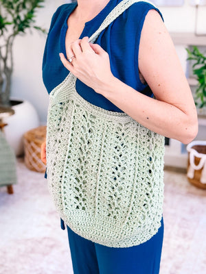 Sage green Willow Mesh crochet market bag showing the openwork stitch
