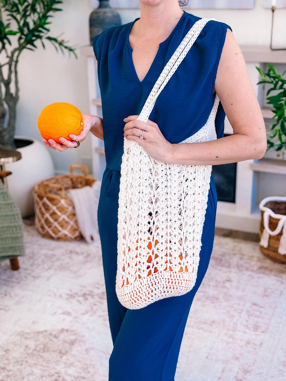 Cream Willow Mesh crochet market bag carrying oranges