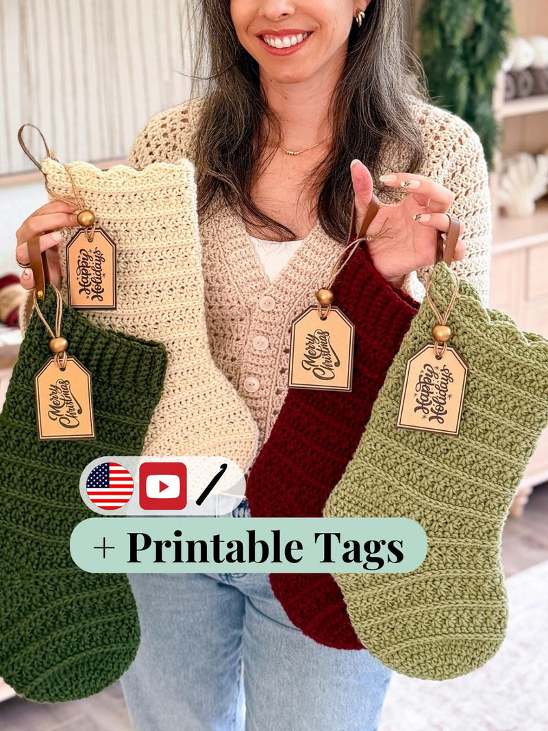 Woman holding four crochet stockings in green, cream, red and sage with printable holiday tags