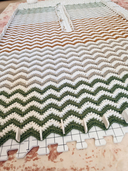 Ripple Crochet Ruana pinned flat on blocking mats