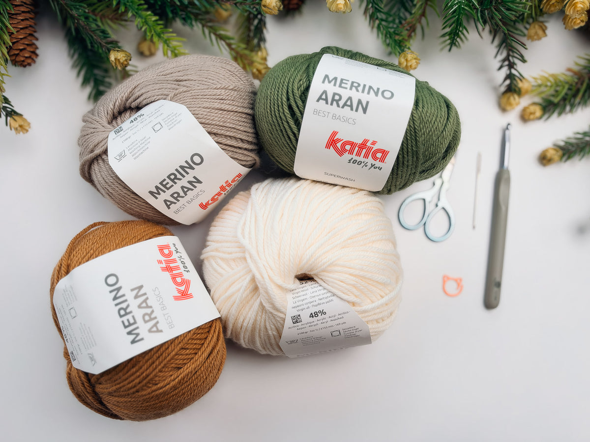 Katia Merino Aran yarn in White, Camel, Sand, and Medium green with a 5.5mm hook