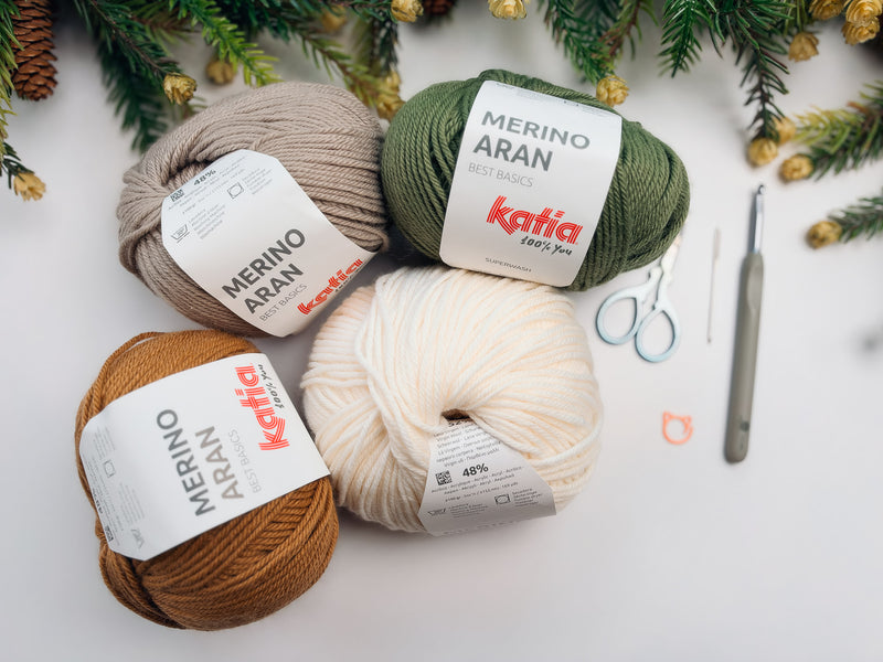 Katia Merino Aran yarn in White, Camel, Sand, and Medium green with a 5.5mm hook