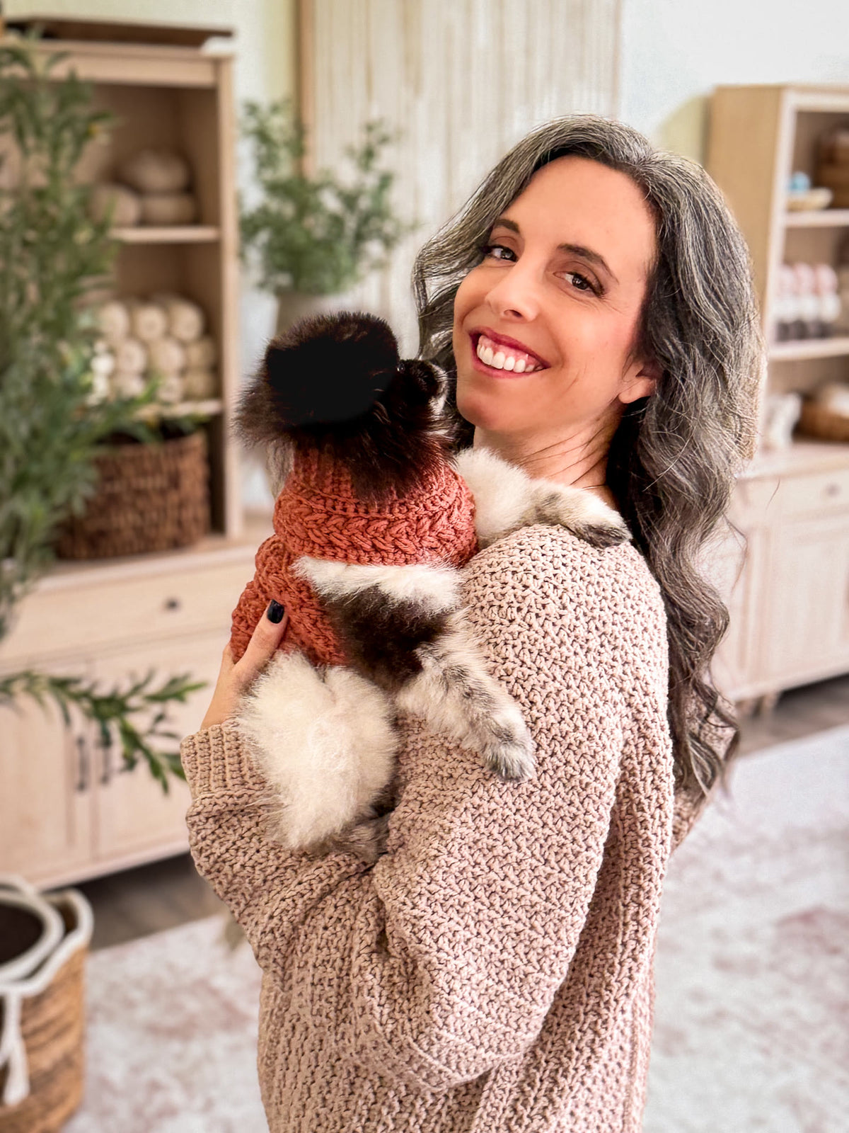Briana and her dog in matching Wheat Stitch crochet sweaters