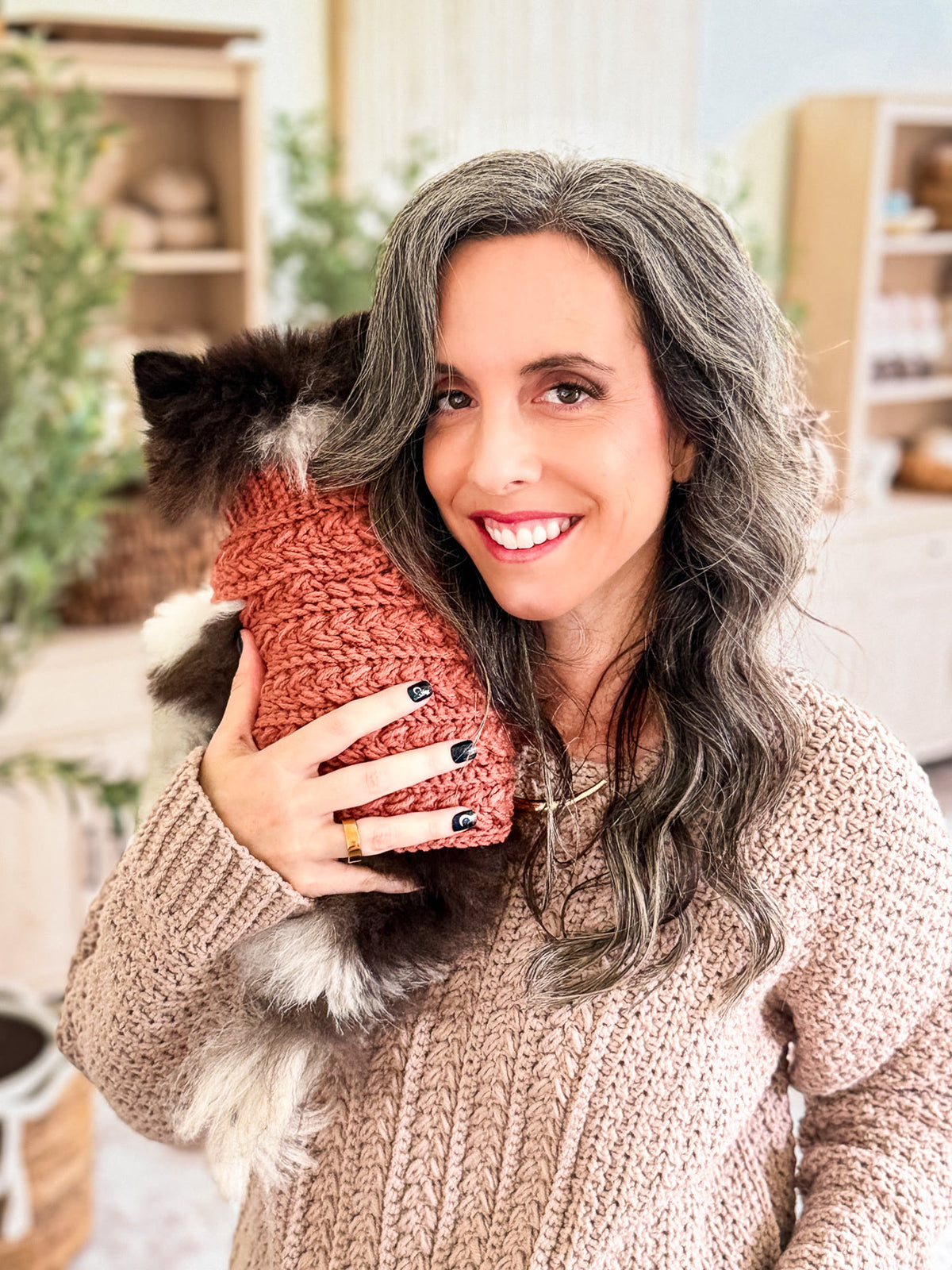 Briana and her dog in matching Wheat Stitch crochet sweaters