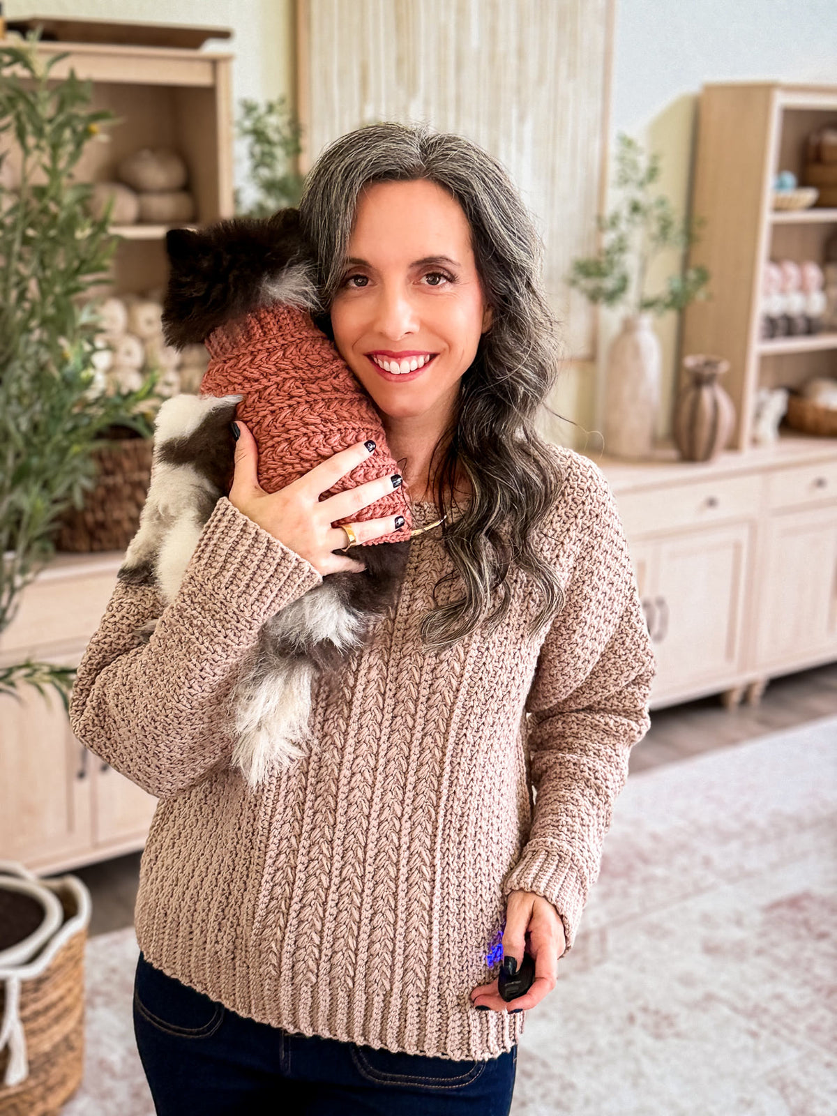 Briana and her dog in matching Wheat Stitch crochet sweaters