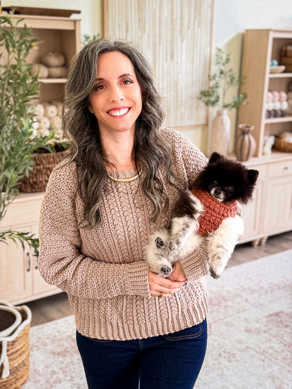Briana and her dog in matching Wheat Stitch crochet sweaters